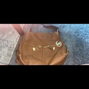 Mk bag very Spacious and only used a few times